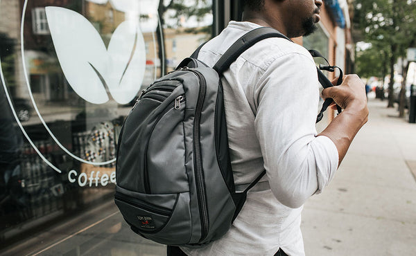 Person wearing Synik 22 outside of a coffee shop